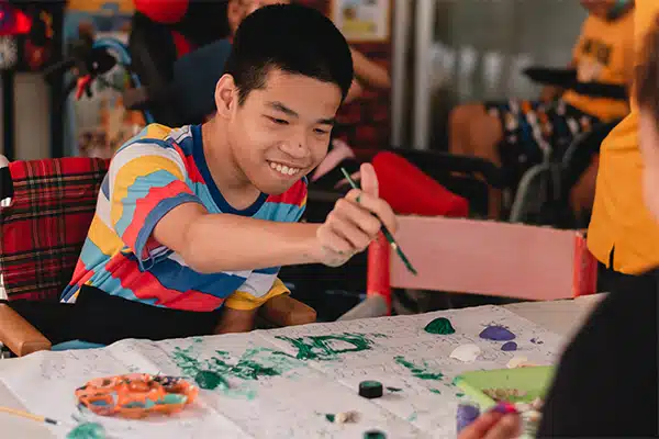 Child painting at a table